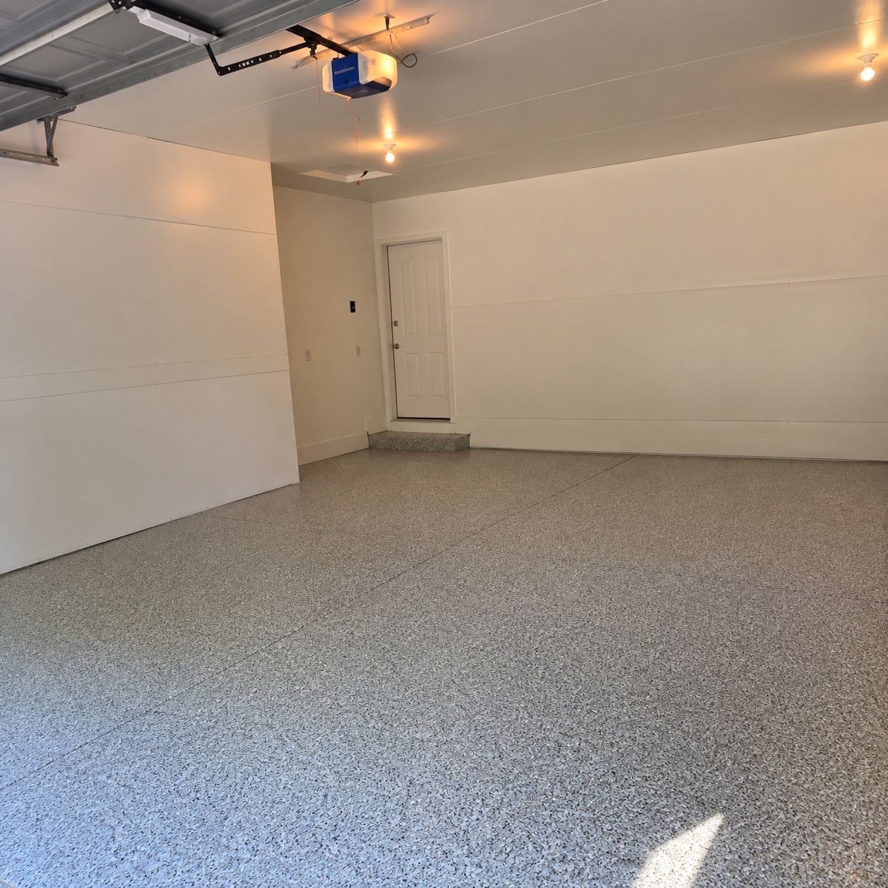 Finished ArmorShield flake garage floor coating in a Wausau-area attached garage